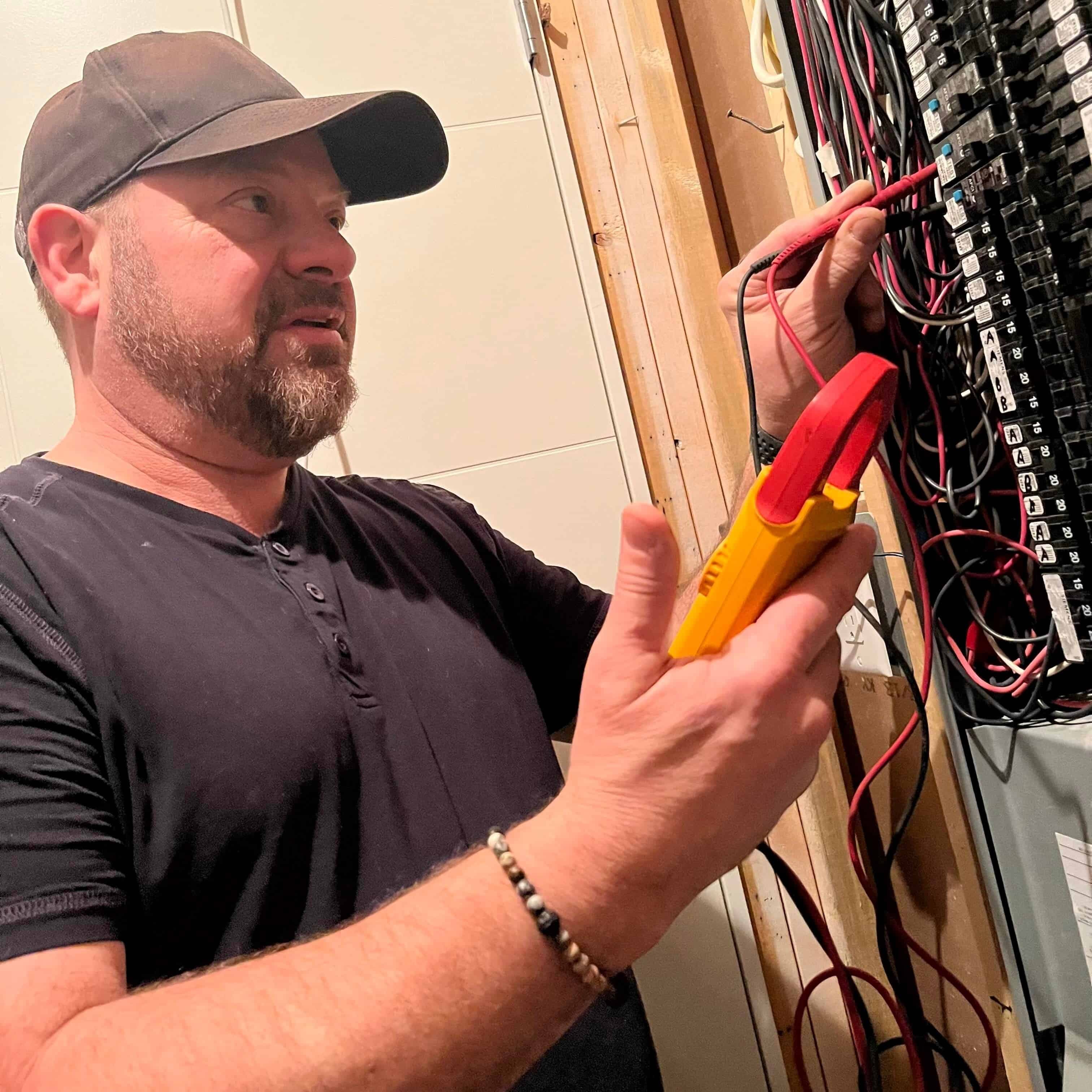 Beretta Electric Electrician Kal Buterman Testing Panel in Vernon, British Columbia.